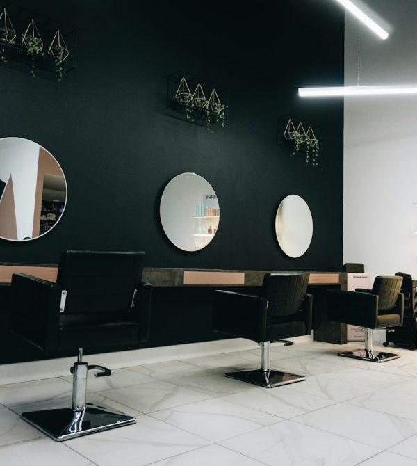 Salon chairs facing round mirrors