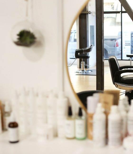 Salon chair beside a mirror