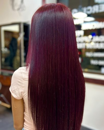 Long straight burgundy-coloured hair
