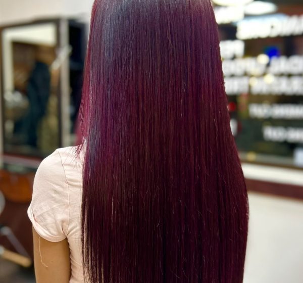 Long straight burgundy-coloured hair