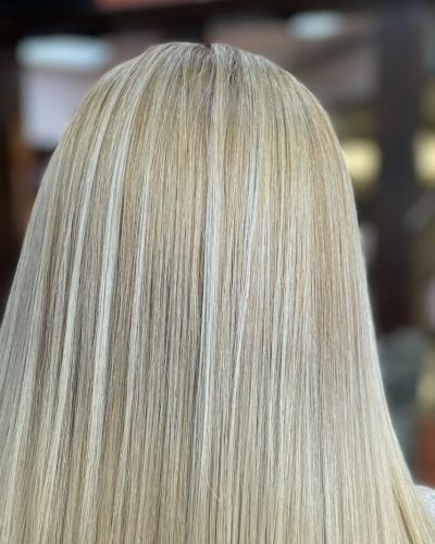 Sleek straight blonde hair seen from behind