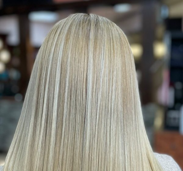 Sleek straight blonde hair seen from behind