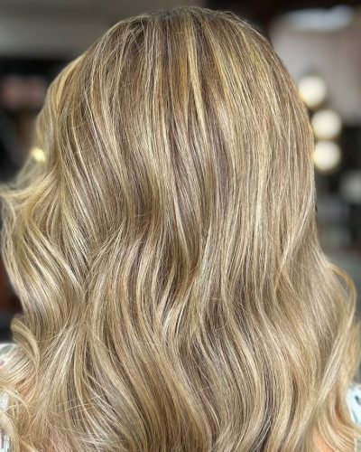 Blonde hair styled in soft curls