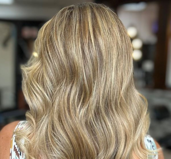 Blonde hair styled in soft curls