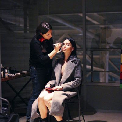 A woman getting her makeup done