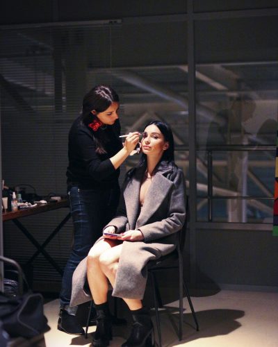 A woman getting her makeup done