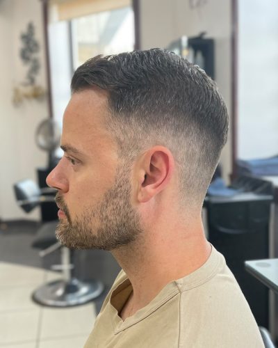 Man with a skin fade haircut and short beard