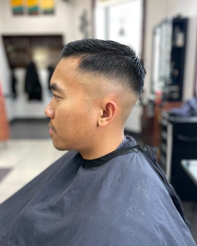 Man with a comb-over fade haircut