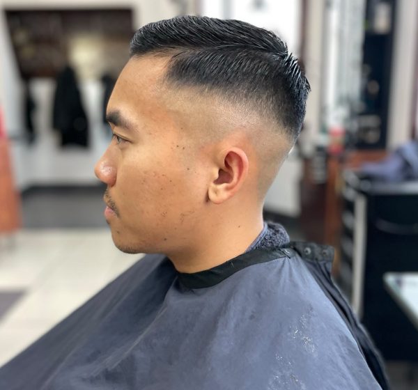 Man with a comb-over fade haircut