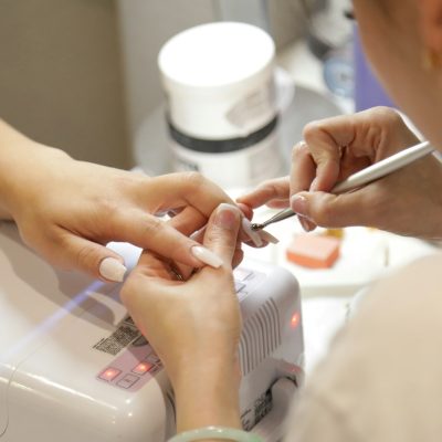 A woman getting her nails done at a salon